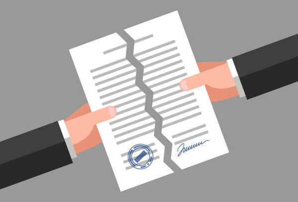 Two hands are tearing up a signed paper. Cancellation of contract, document or agreement. Business concept